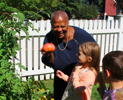 Nolda Joseph, PIFS Kitchen Manager, picks vegetables for the children’s lunch.